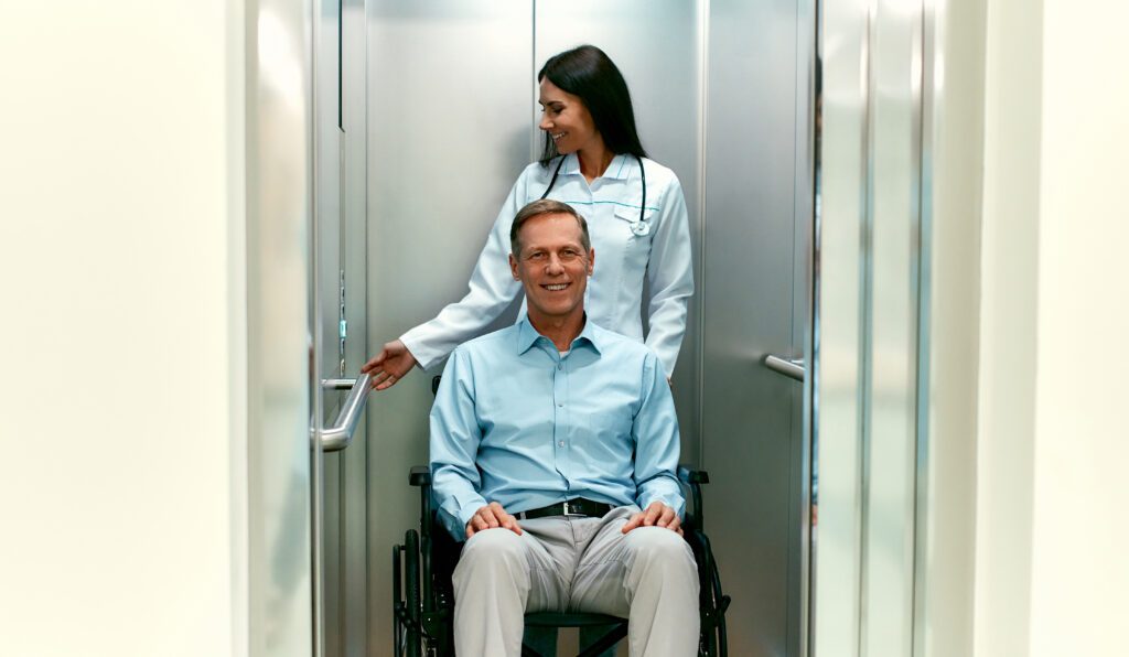 person in a wheelchair in an elevator 