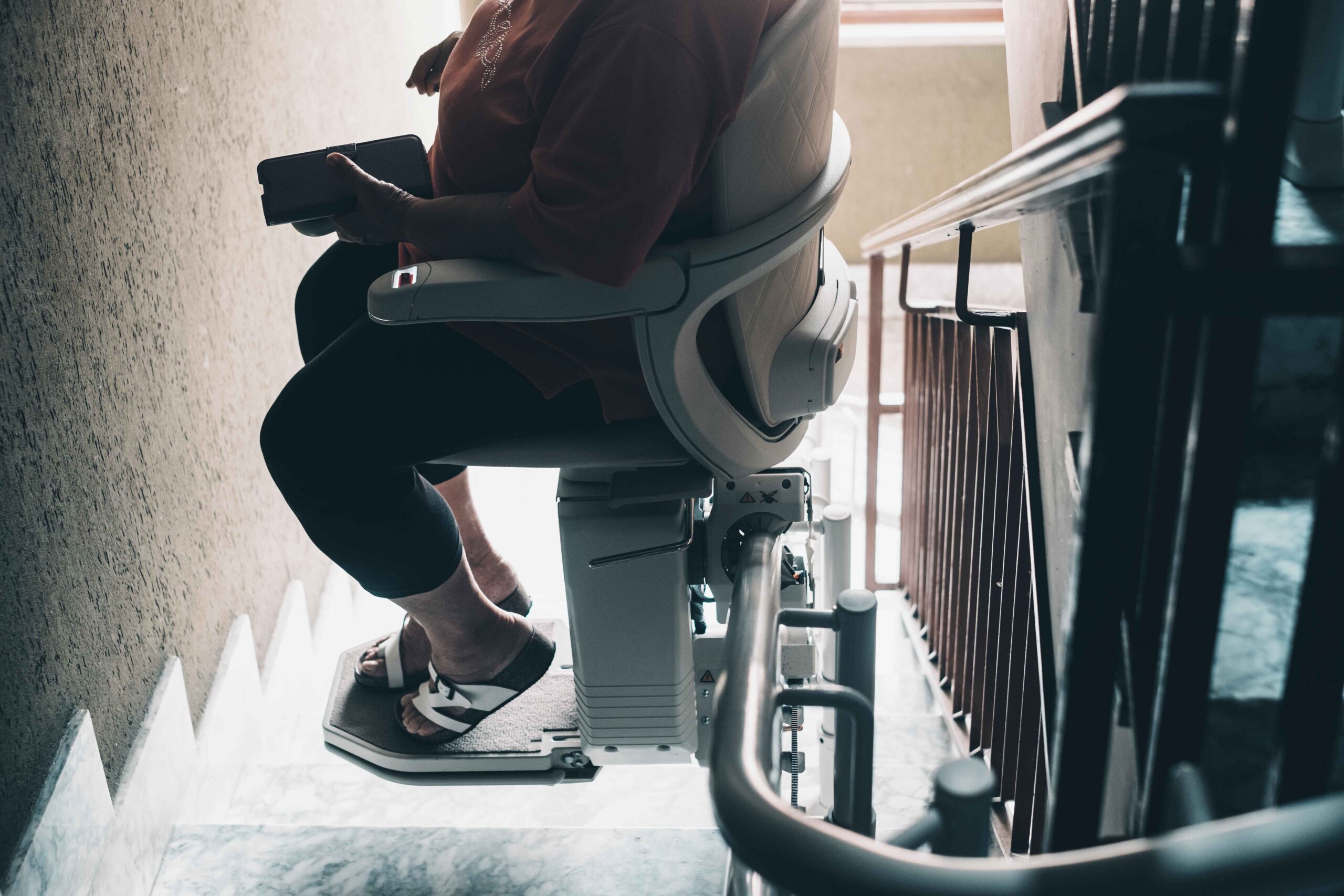 Person riding home stairlift